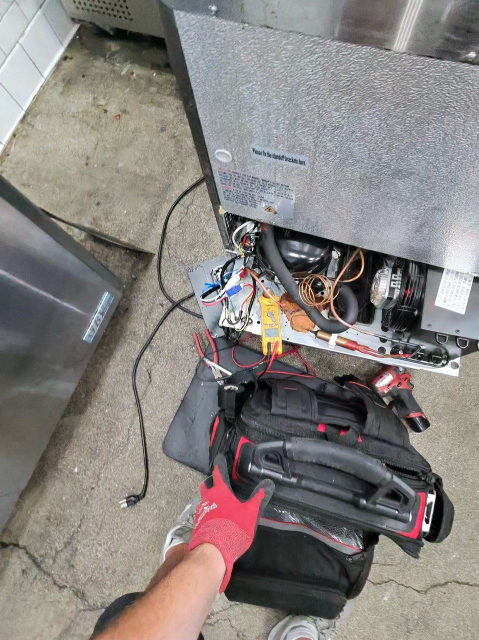 Technician working on a commercial cooler in Hermosa Beach.